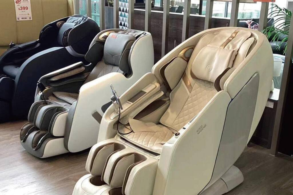 massage chairs white black and cream colour sitting in a row