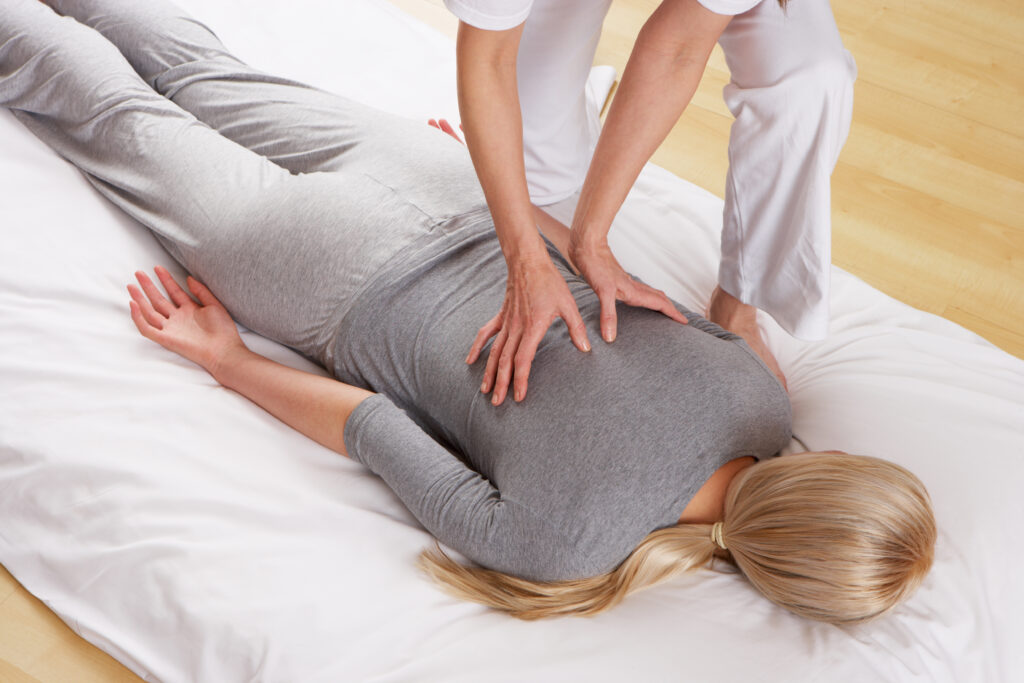 woman on pillow having a shiatsu massage experience